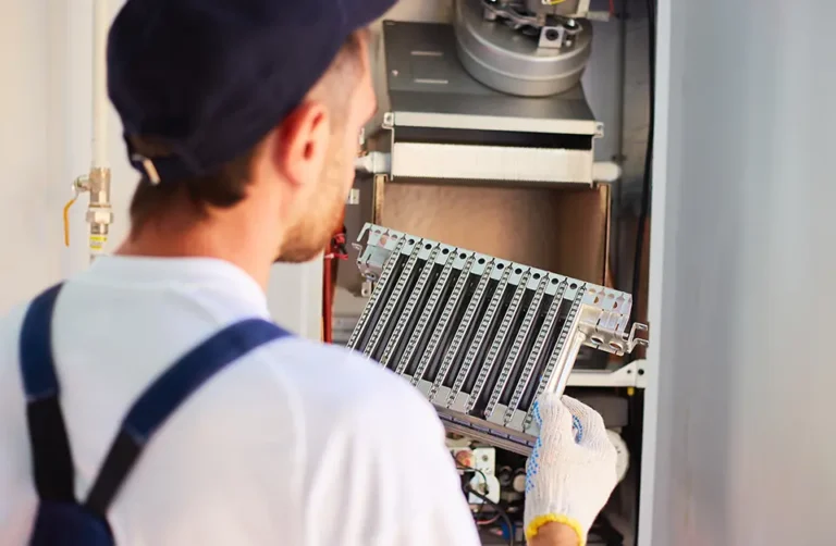Commercial gas engineer working on gas appliance maintenance
