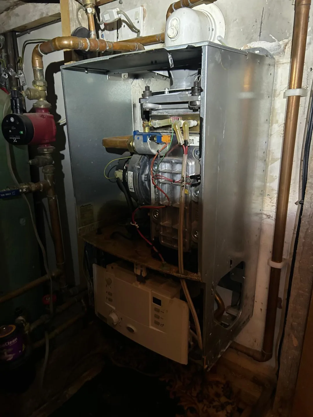 Floor-standing boiler opened up, burner and controls exposed for inspection