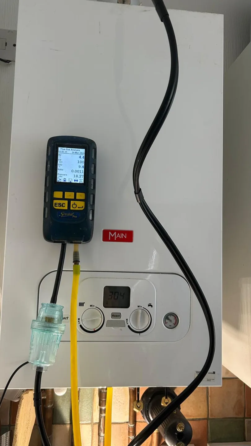 Analyser connected to a Main combi boiler, sampling hose running to the flue test point