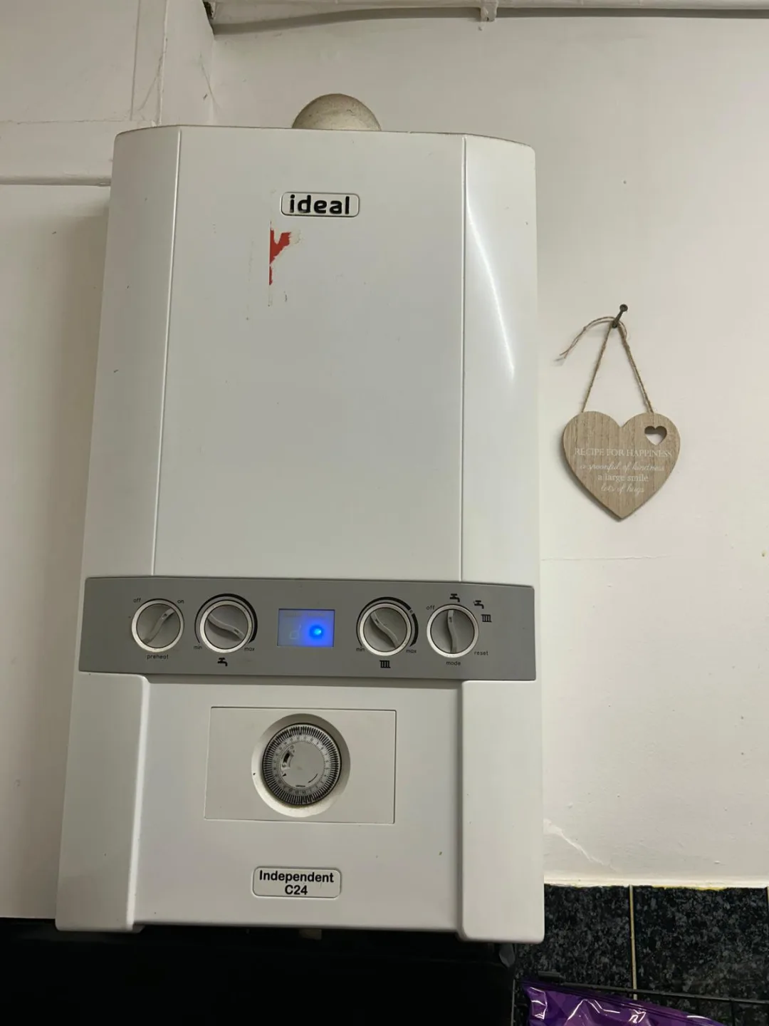 Ideal Independent C24 boiler mounted on a tiled wall
